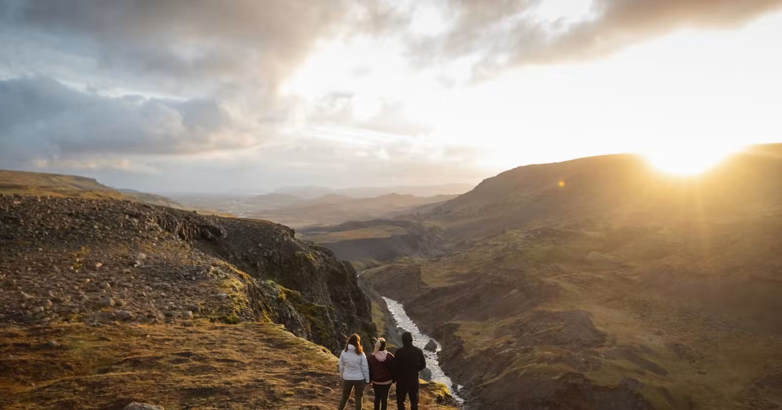 Hikers near Haifoss in bright Iceland summer light