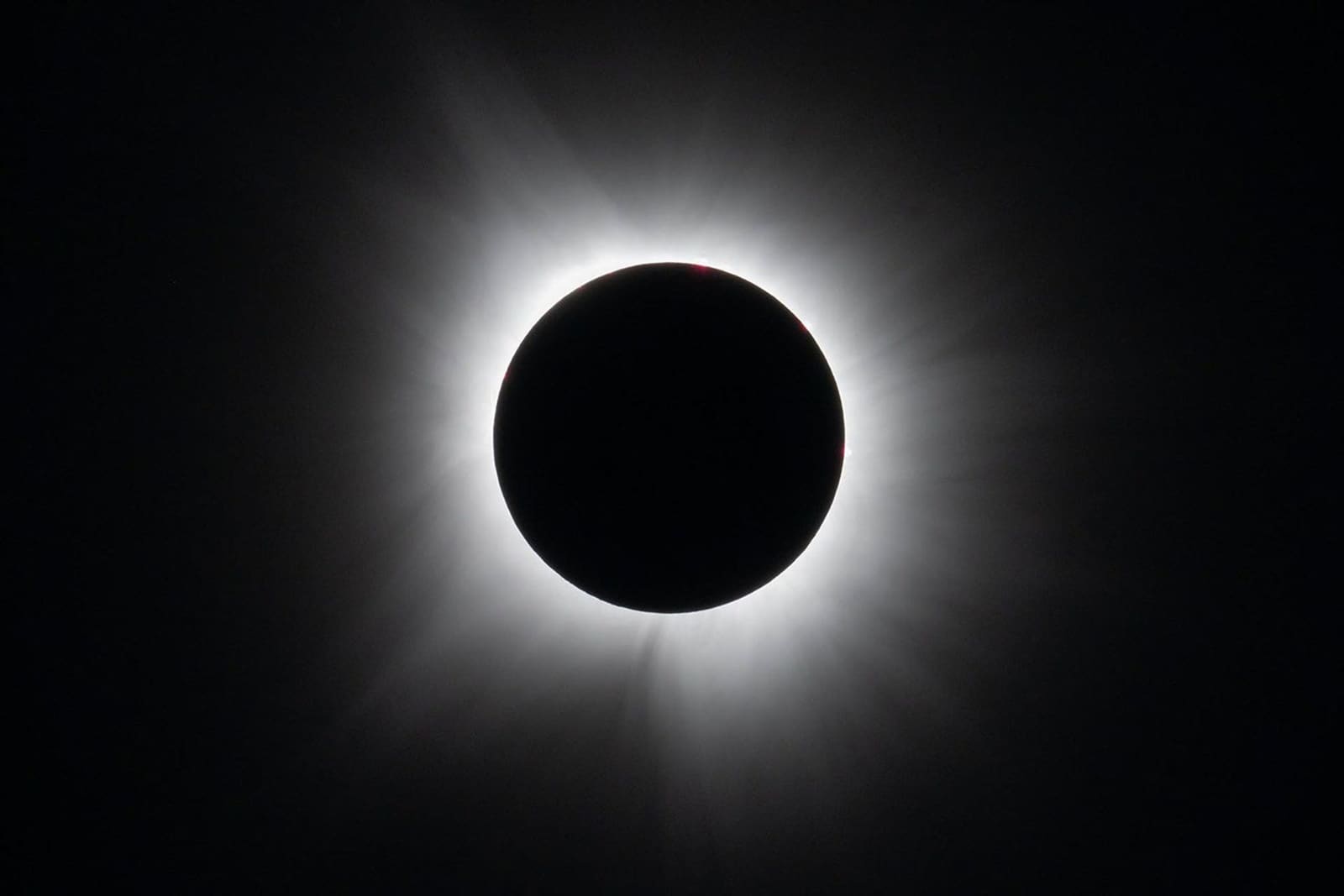 Total solar eclipse with the Moon covering the Sun and the white corona visible
