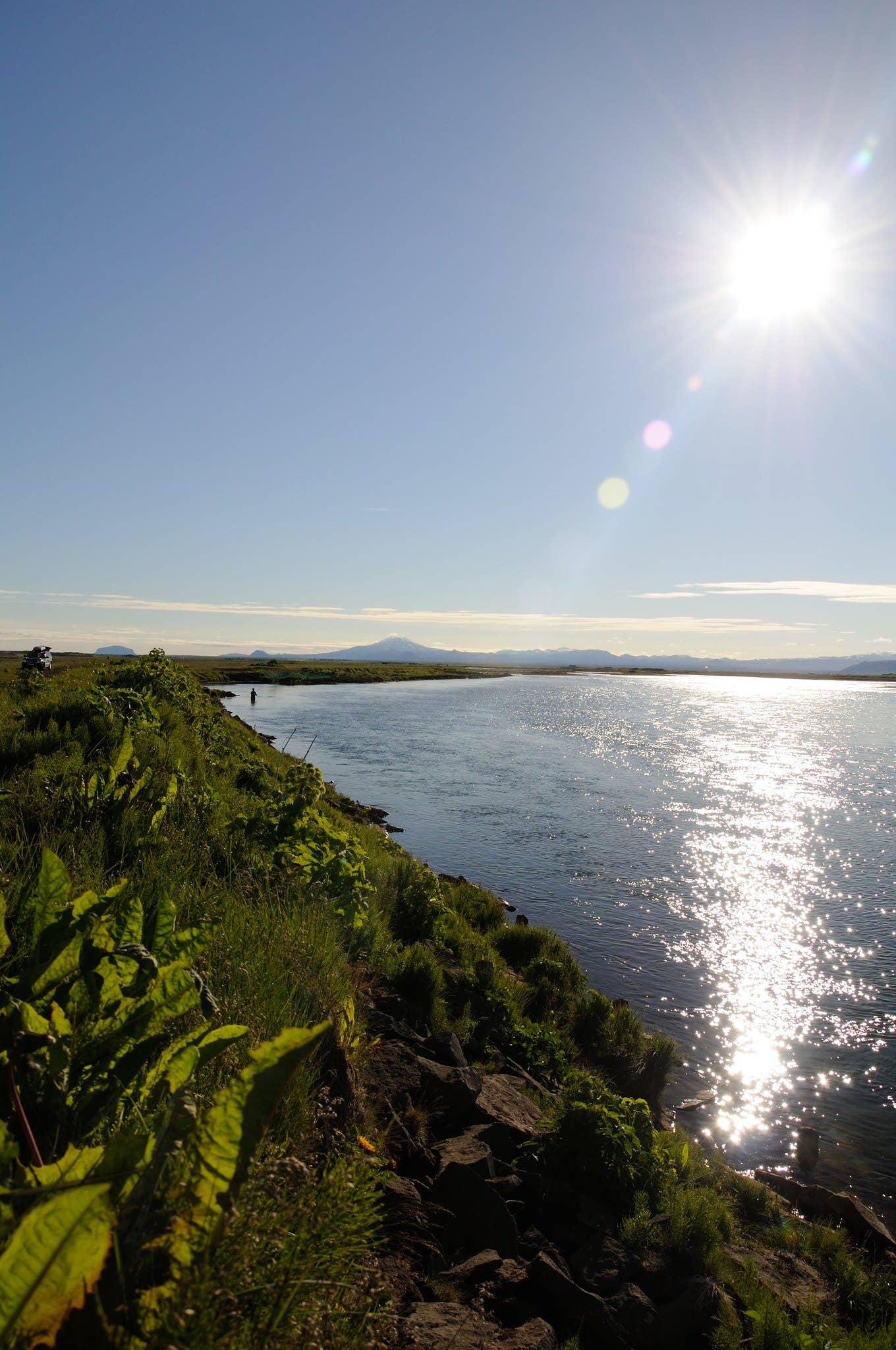 Ytri-Rangá flowing through grassy South Iceland riverbanks near Hella.