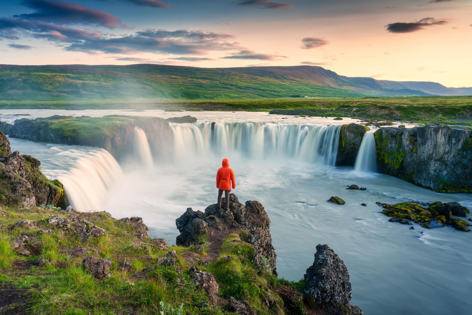 Goðafoss waterfall spreading across a wide rocky ledge in North Iceland.