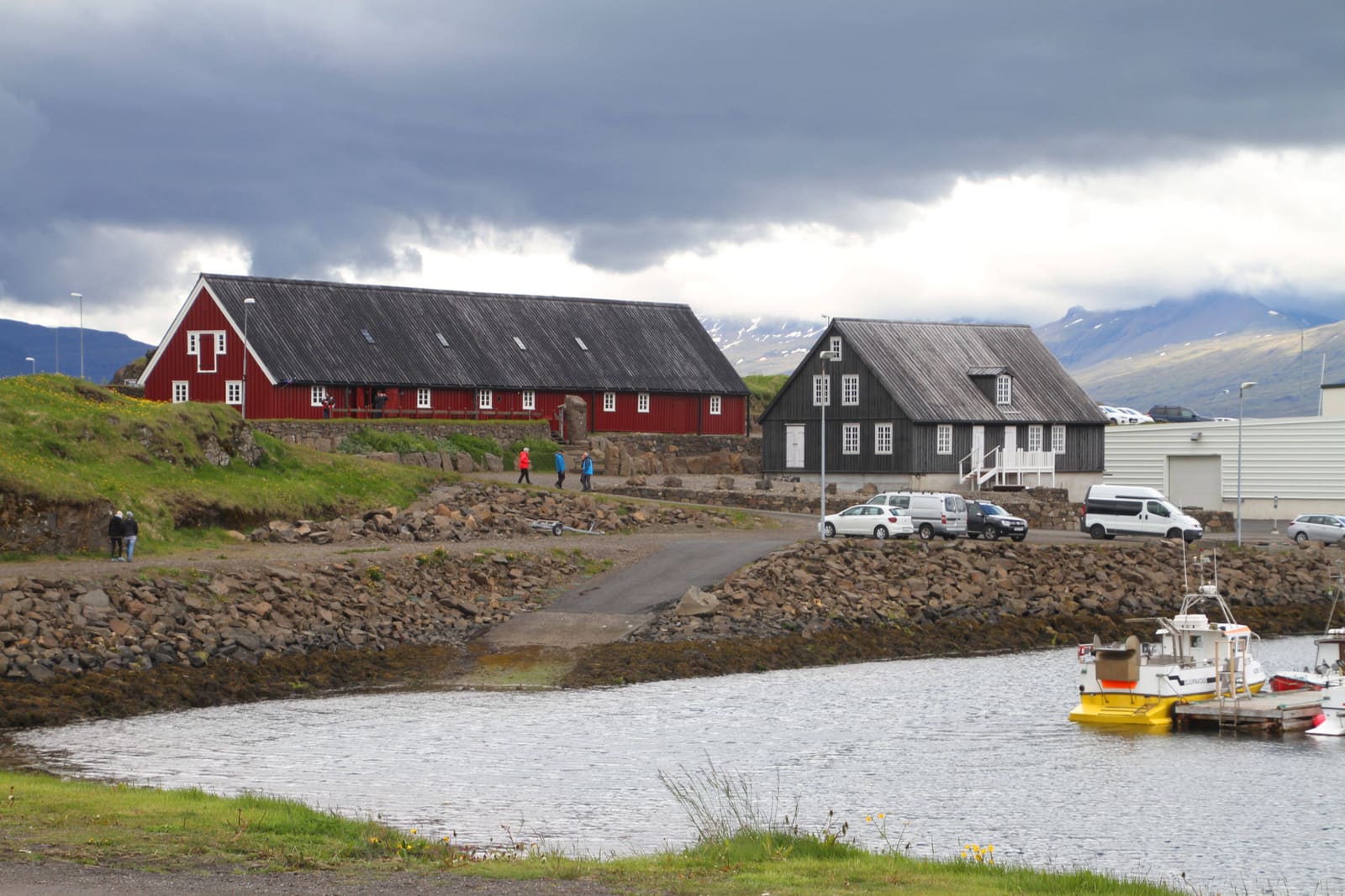 Red Langabúð Cultural Center building by the harbor in Djúpivogur