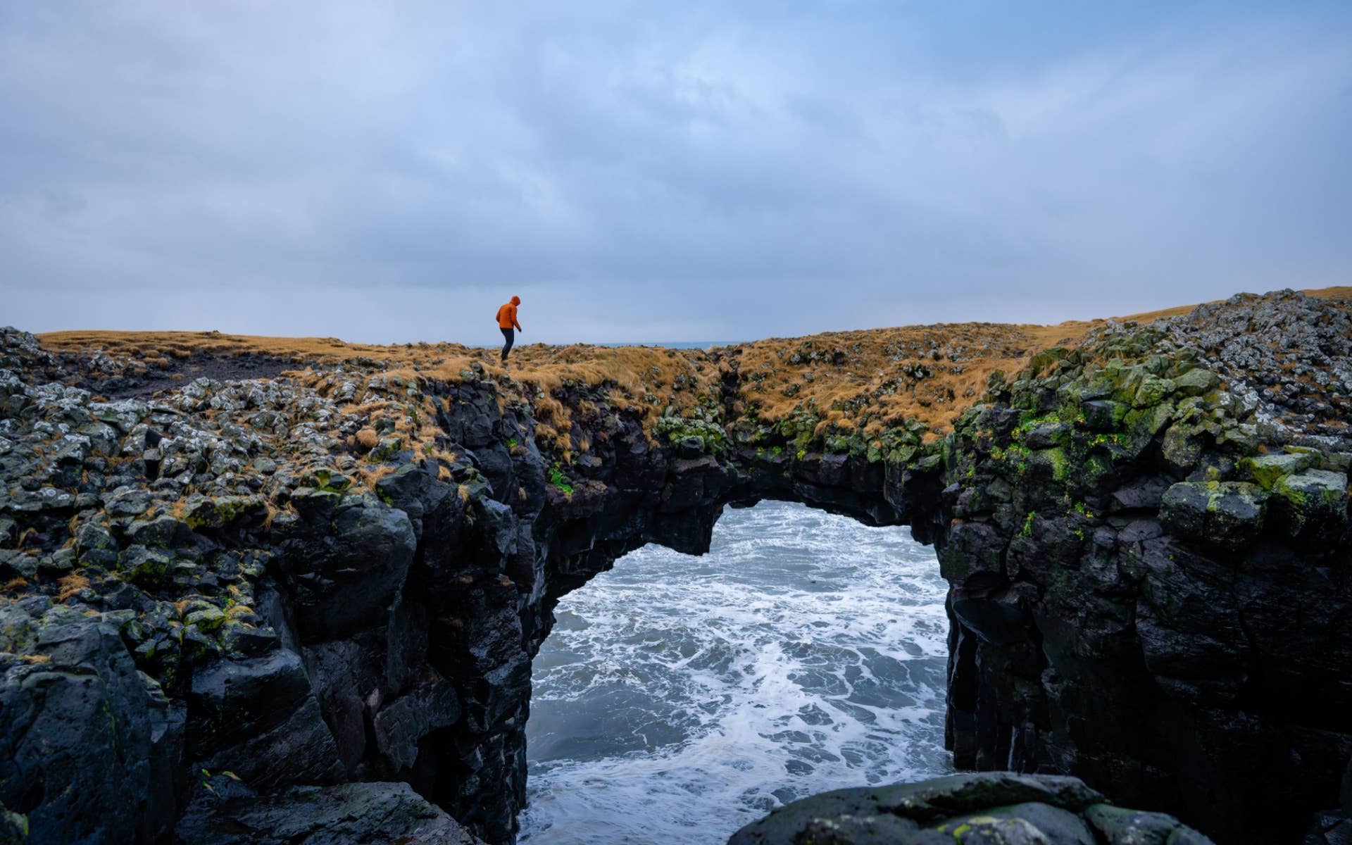 Natural stone arch over the Atlantic coast in Snæfellsjökull National Park.