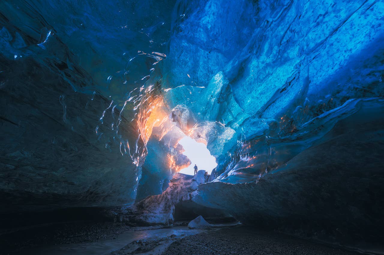 Curving blue ice ceiling and frozen textures inside Crystal Ice Cave