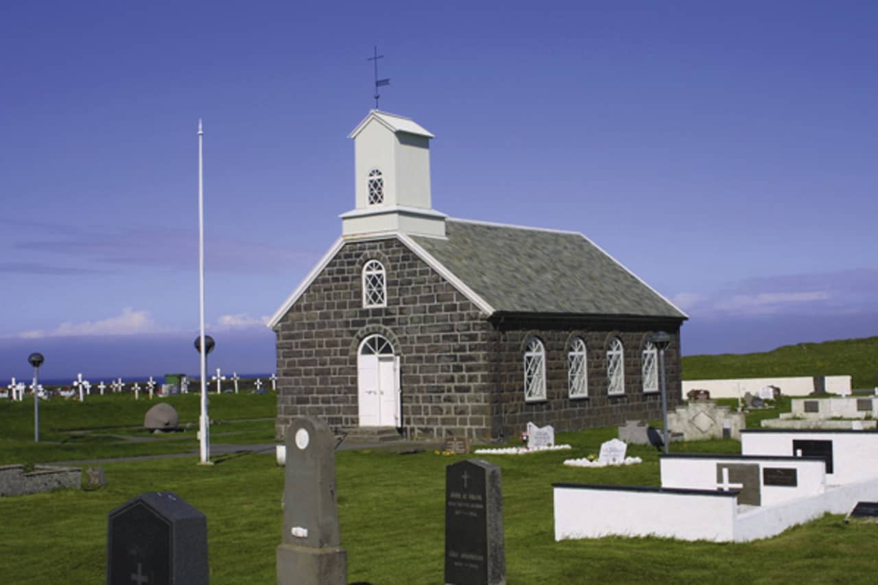 The preserved stone church in Innri-Njarðvík near the shore.