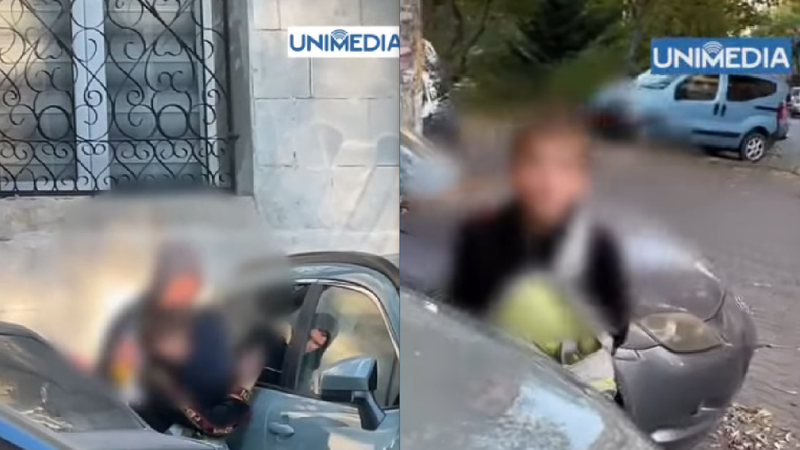  (VIDEO) „Ce faci acolo”? Momentul în care un copil „topește” sticla unei mașini, încercând să o spargă, iar altul stă la pândă: Părinții, chemați la sector