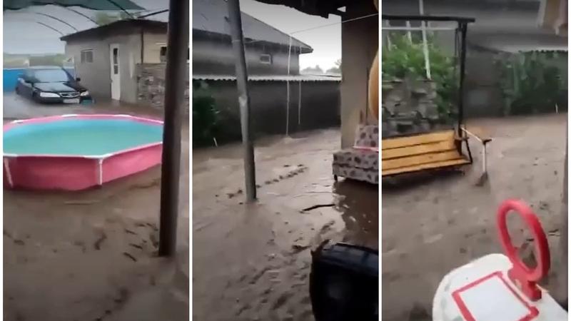  (VIDEO) „Doamne ferește. E strașnic”. O gospodărie din Cahul, sub apă, după ploaia de aseară: Șuvoaiele au inundat și mașina parcată în curte