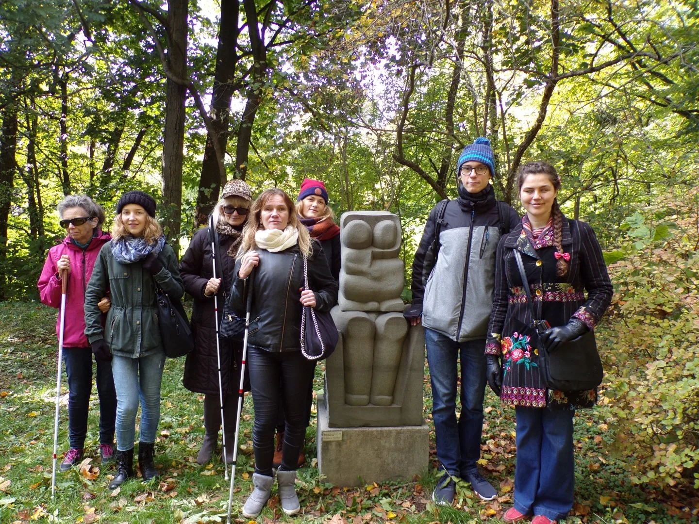 A diverse group enjoys a guided walking tour, showcasing accessible tourism.