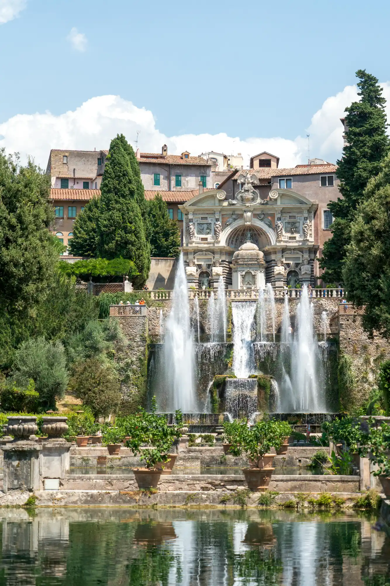 The Organ Fountain at Villa d'Este in Tivoli, with jets of water cascading down terraces into a pool surrounded by gardens.