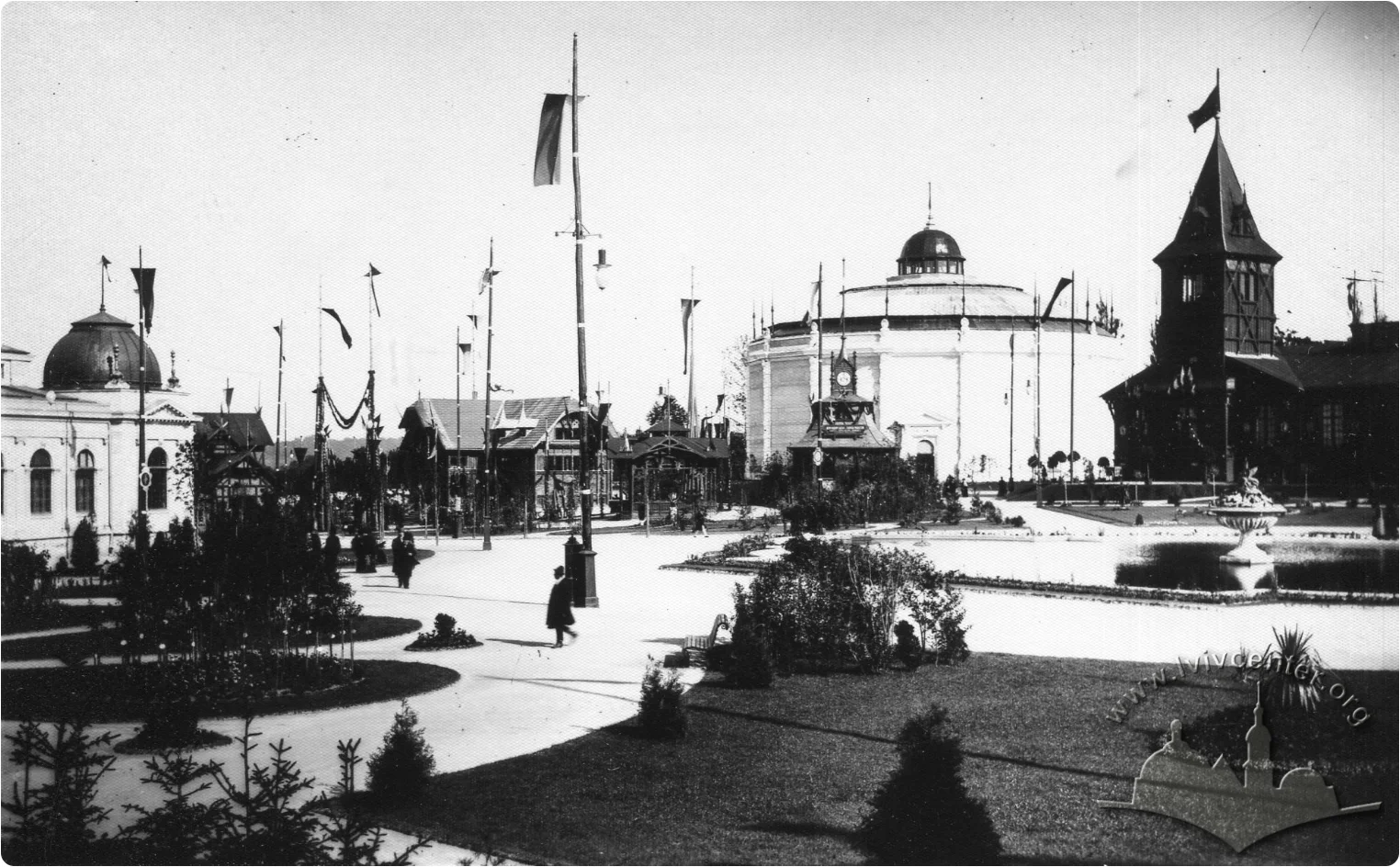 Historical view of exhibition grounds in Lviv with decorative pavilions, a panorama rotunda, and paths.