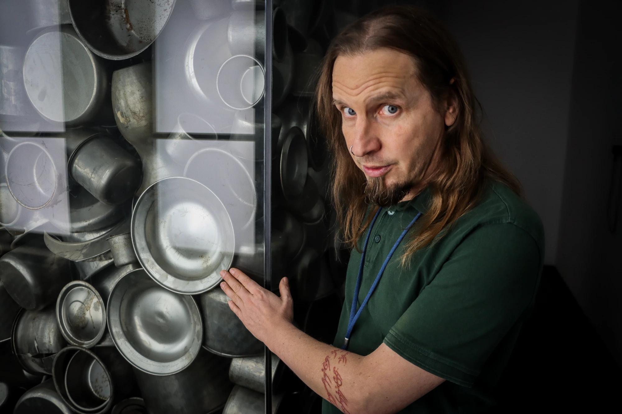 Tour group listening to guide in a museum exhibit.
