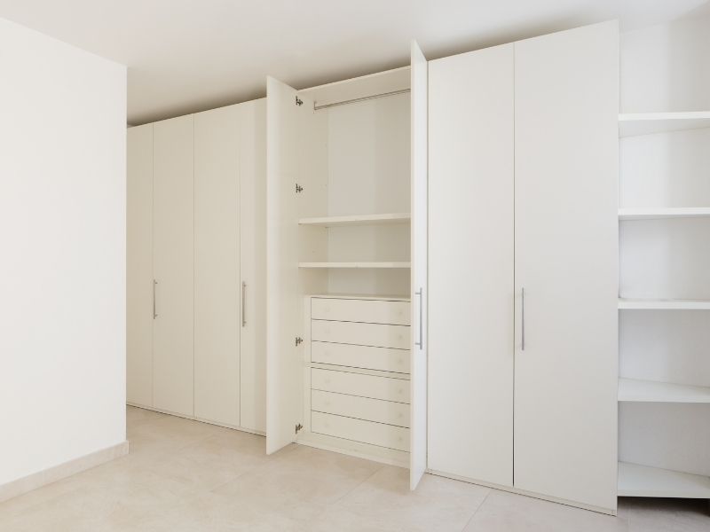 fitted wardrobes with bed in the middle